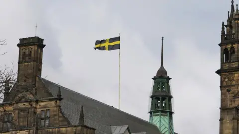 Oli Constable/BBC The flag of Saint David being flown over Sheffield Town Hall