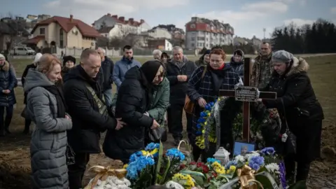 Getty Images A funeral in Lviv for a soldier who died in Bakhmut