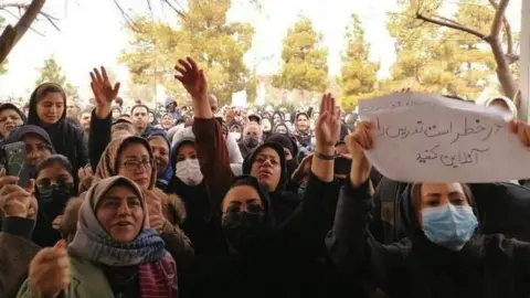 IRNA Parents protesting outside the Qom governor's office