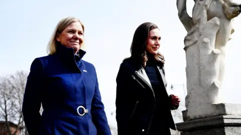 Getty Images Swedish Prime Minister Magdalena Andersson (L) and Finnish Prime Minister Sanna Marin prior to a meeting on whether to seek NATO membership in Stockholm, Sweden, on April 13, 2022