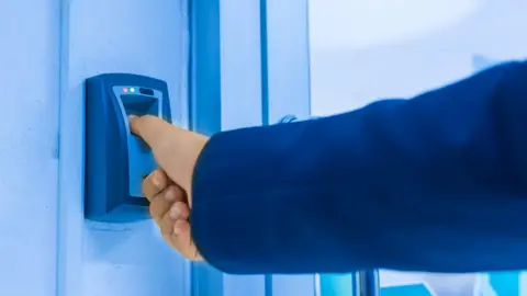 Getty Images A fingerprint reader in a secure building