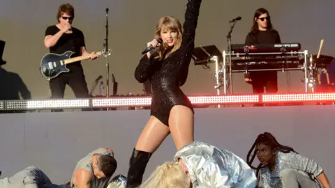 Getty Images Taylor Swift performing in Swansea