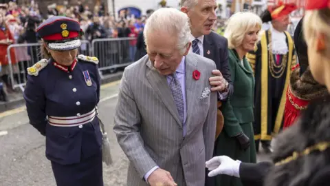 PA Media/The Times King Charles III reacts after an egg was thrown in his direction as he arrived for a ceremony at Micklegate Bar in York