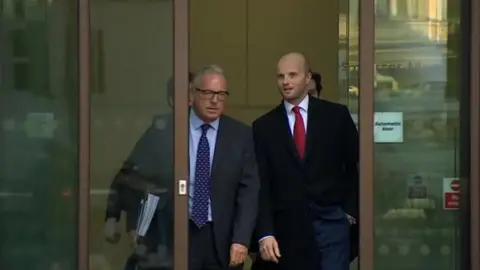 Adam Simmonds ( with red tie)