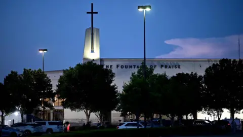 AFP Media set up in front of the Fountain of Praise church where services will be held for George Floyd on 8 June in Houston, Texas