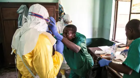 AFP/Getty Health workers at Bikoro hospital in DR Congo