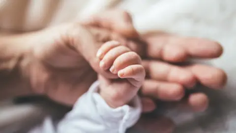 Getty Images Baby's hand