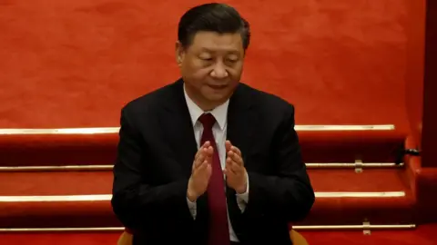 Reuters Chinese President Xi Jinping applauds at the closing session of the Chinese People"s Political Consultative Conference (CPPCC) at the Great Hall of the People in Beijing, China March 10, 2021.