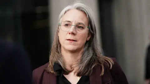 PA Media Unison's Sara Gorton, who chairs the NHS staff council, pictured outside the union's head office in London