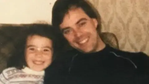 A young Monica Lennon with her brother and dad Gerry