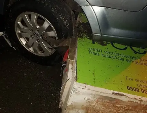 Sarah Louise Ellwood ATM wedged beneath parked car