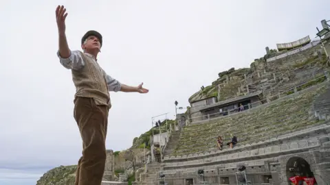 Getty Images Actor Mark Harandon rehearsing alone at the open air Minack Theatre in Cornwall