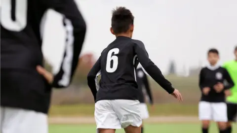 Getty Images footballer wears number six