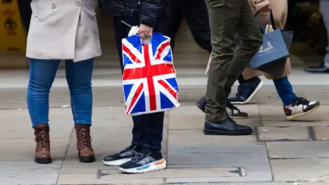 Shoppers walking on a High Street