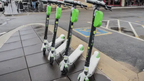 Getty Images Lime scooters on a street
