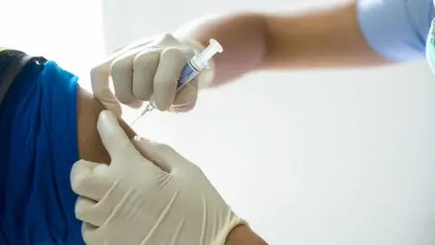 Getty Images A person being given the vaccine