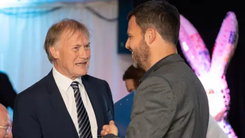 Havens Hospices Steve Smith, chief executive of Havens Hospices, with Sir David Amess