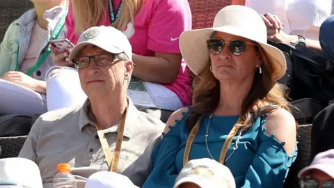 Getty Images Bill and Melinda Gates watching tennis