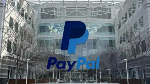 Getty Images A PayPal sign is seen at its headquarters.