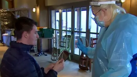 Man holding swab about to do test