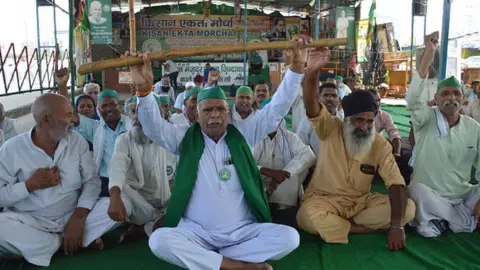 Getty Images Farmers of Bharatiya Kisan Union protesting against Lakhimpur Kheri incident, at Ghazipur border protest site