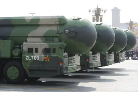 EPA Military vehicles carrying the DF-41 intercontinental ballistic missile roll through Tiananmen Square in Beijing during a military parade marking the 70th anniversary of the founding of the People's Republic of China, on 1 October 2019.