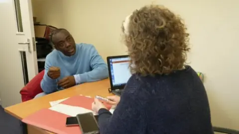 BBC Thomas talking to Sally Anderson at MK Money Lifeline