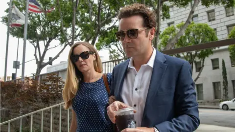 Getty Images Bijou Phillips and Danny Masterson arrive in court for his rape retrial in May