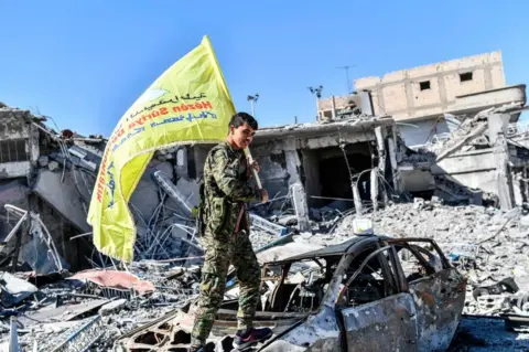 Getty Images US-backed Syrian Democratic Forces took photos in Raqqa, the former IS capitol