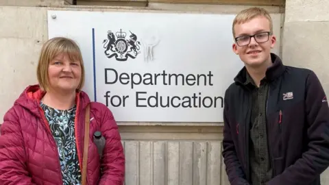 Ann Jillings Ann and David Jillings standing outside Department for Education in London.