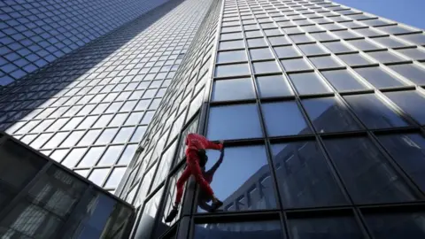 Reuters Alain Robert climbs the Total Tower in Paris on 17 September