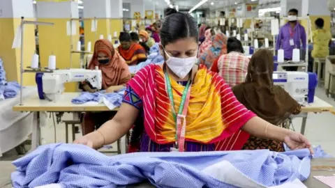 Reuters A woman works in a garment factory in Dhaka, Bangladesh (file photo)