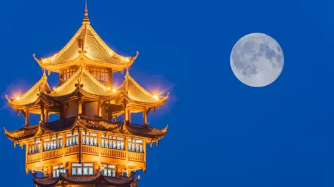 Getty Images Moon over tower in Chengdu, China