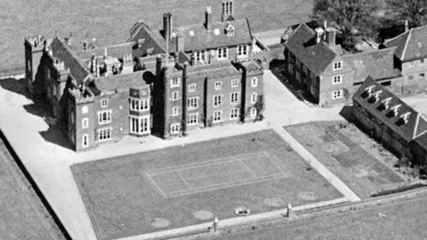 A cropped aerial photograph which shows the front view of Belhus manor house taken from the south, as it was in 1929