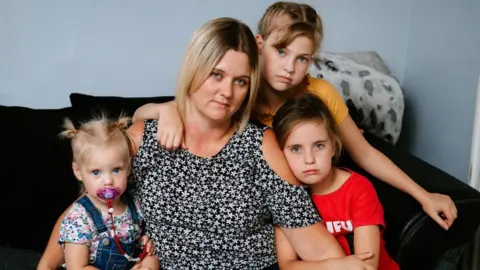 Cascade News Katie Stevenson and three daughters, Lacey, 11, Taleisha, seven, and Skyla, one