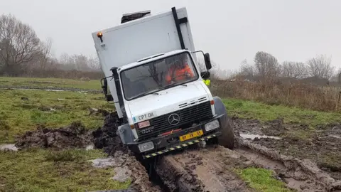 Ben Boylett A Unimog vehicle stuck in peaty soil