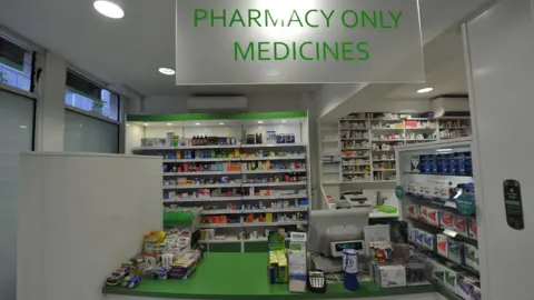 The interior of a pharmacy and its counter