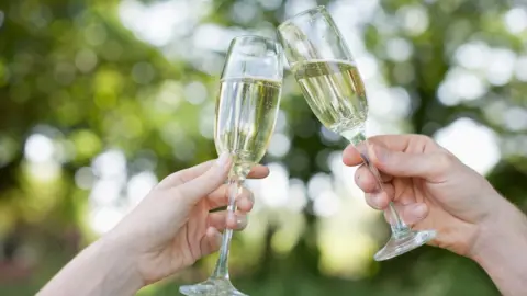 Getty Images Toasting with champagne