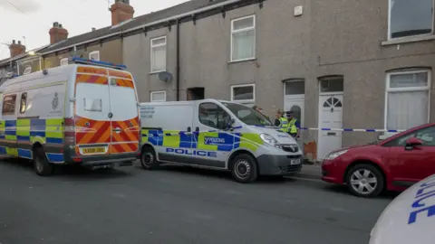BBC Police vans at the scene