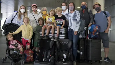 PA Media The Webster Family, who live in Beckenham and Chichester, at Gatwick Airport after returning on a flight from Faro in Portugal