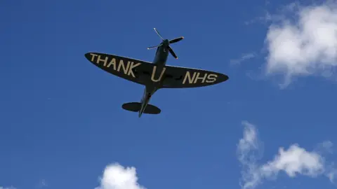 Getty Images A Spitfire plane with the words 'Thank U NHS'