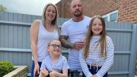 PA Media Michelle Freeman with husband Gavin, son Kaiden and daughter Alexi