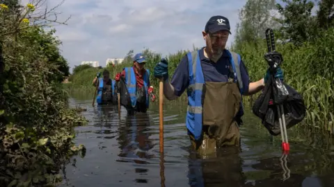 Getty Images Volunteers who clean up rivers often report sewage dumps that water companies do not disclose