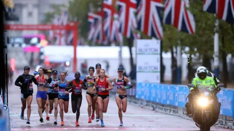 Reuters Britain's Lily Partridge and Stephanie Twell with Australia's Ellie Pashley and runners during the elite women's race of the London Marathon Pool