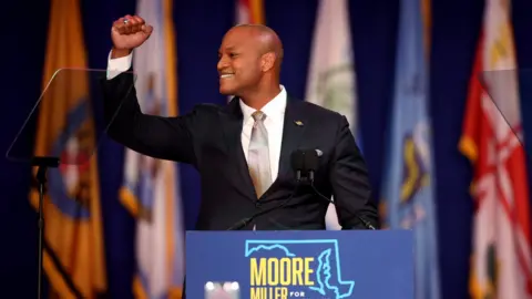 Getty Images Democratic gubernatorial nominee Wes Moore celebrates before addressing supporters after defeating Republican nominee Dan Cox on 8 November 2022 in Baltimore, Maryland.