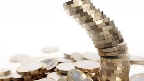 Getty Images Pound coins tumbling