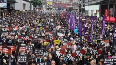 Getty Images Tens of thousands of protesters marched in Hong Kong on January 1