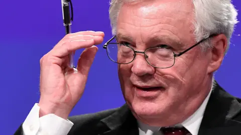 Getty Images David Davis looks over his glasses