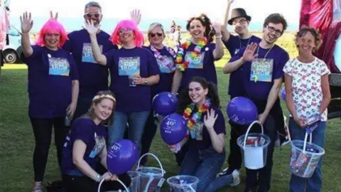 Cromer Pier Ms Raby with theatre staff at the carnival