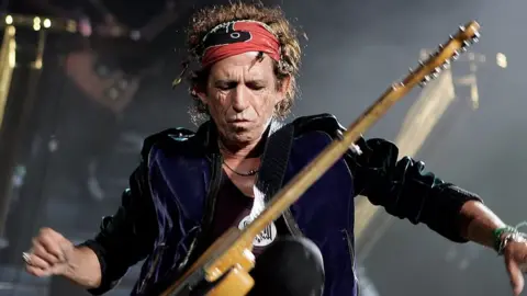 Getty Images Keith Richards plays on stage with the Rolling Stones